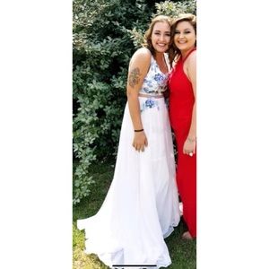 white prom dress with blue and teal flower design